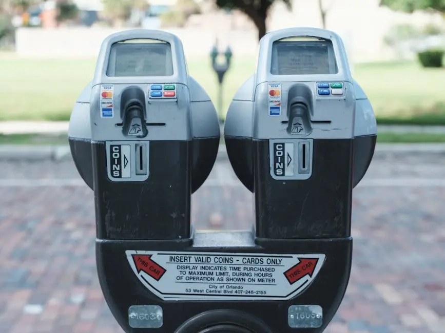 Photo of two parking meters in Orlando showing coin and card payment options on a brick road.