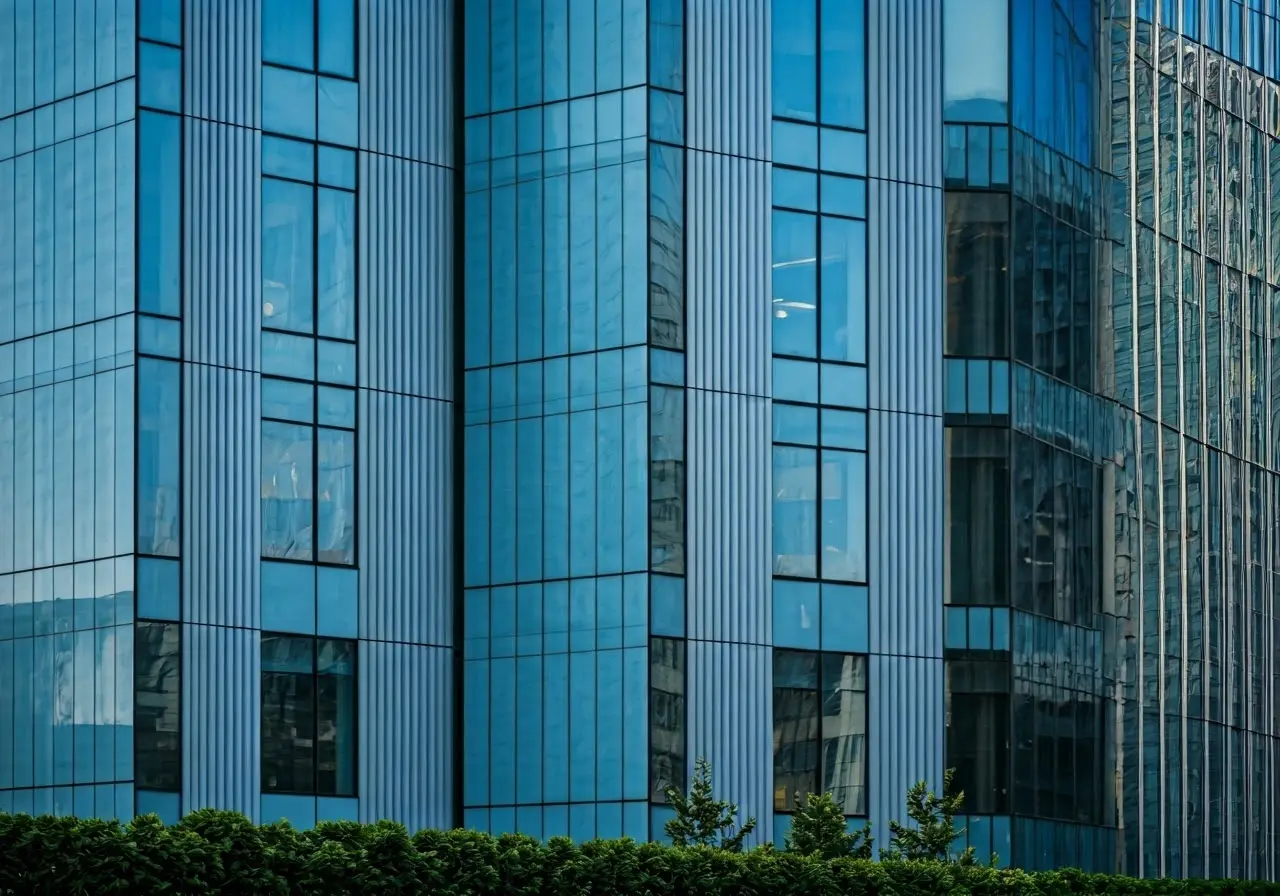 A modern office building with a prominent IT services sign. 35mm stock photo