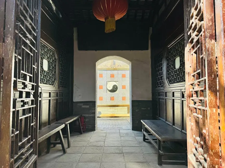 Entrance view of a traditional Chinese courtyard featuring a prominent Yin Yang symbol.