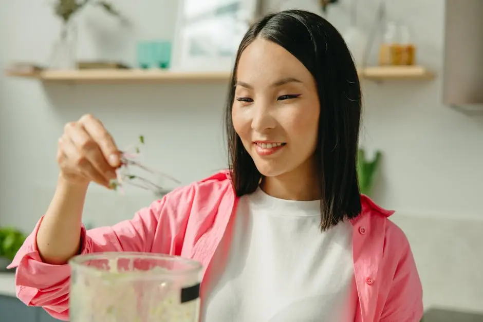Young woman cooking with vegetables in a bright kitchen setting, embracing healthy eating.