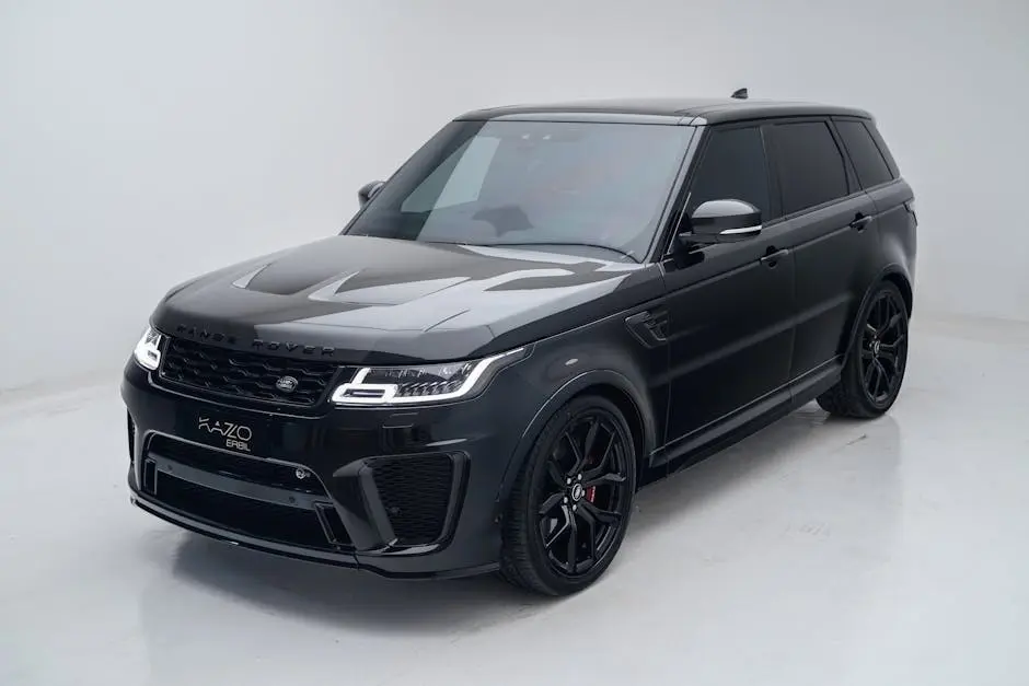 Elegant black SUV parked indoors with a clean, minimalist white background.