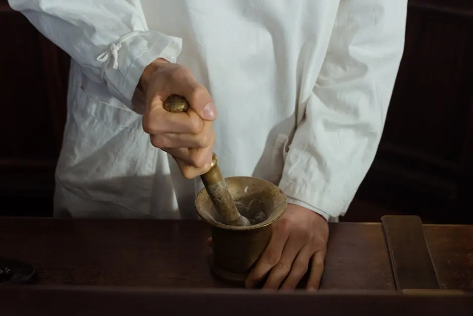 Pharmacist grinding ingredients using a mortar and pestle. Traditional pharmacy preparation.