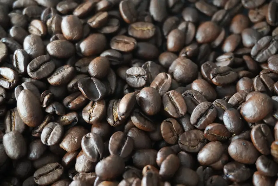 Detailed shot of aromatic roasted coffee beans, perfect for caffeine lovers.