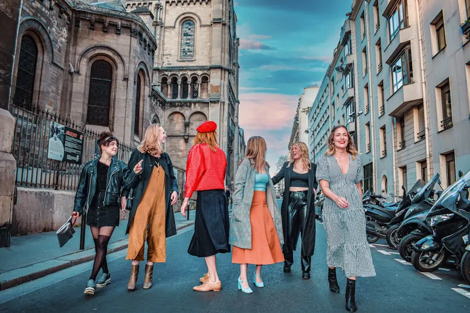 A group of fashionable women walking down a picturesque Paris street, showcasing modern style.