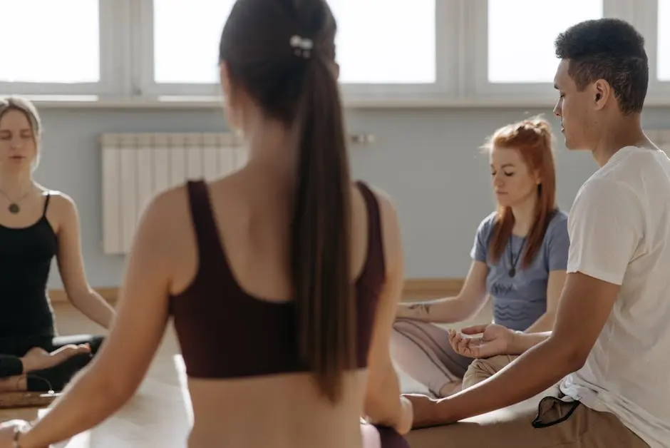 A diverse group practicing mindfulness meditation in a serene yoga studio setting.