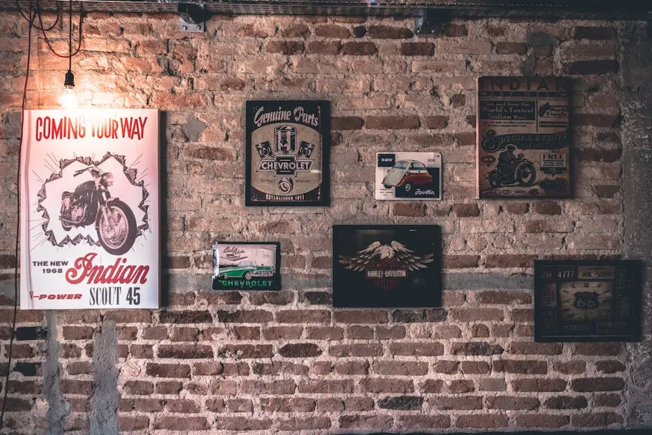Retro wall art featuring motorcycle and car signs on a rustic brick wall.