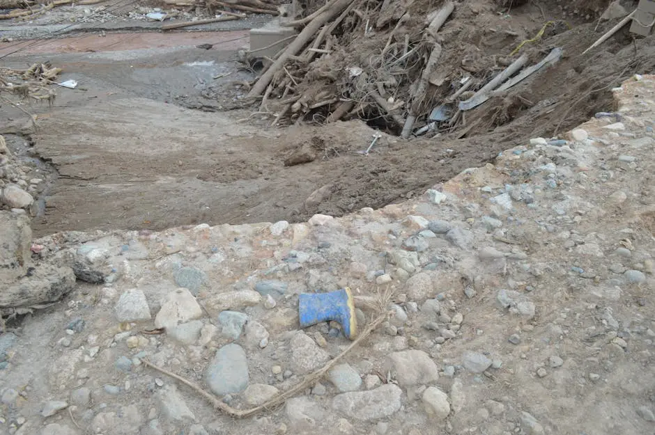 A landscape showing mud, debris, and a lone boot in Mocoa, Colombia&rsquo;s natural disaster aftermath.