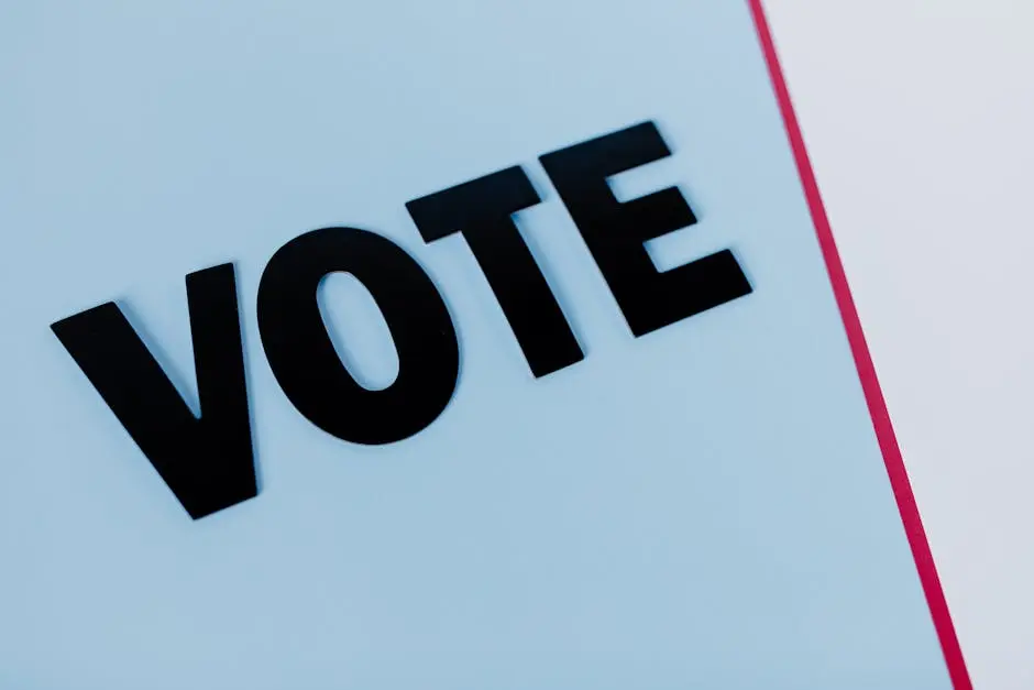 Close-up of the word &lsquo;VOTE&rsquo; on a minimal background, emphasizing voting importance.